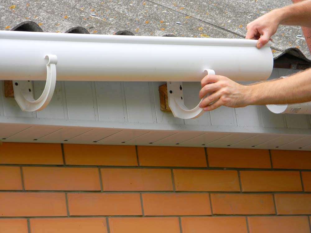 Hewatt technician installing new gutters Hewatt technician installing new gutters